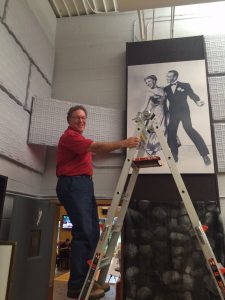 That's me up high on a ladder holding a sound board!