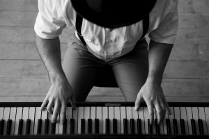 Talent and virtuosity. Black and white top view image of man playing piano