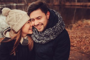 happy couple walking outdoor in autumn forest, cozy mood